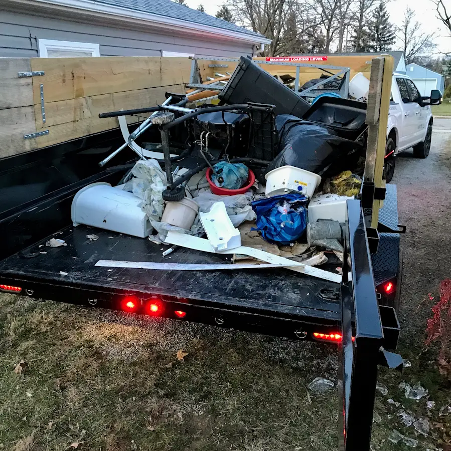 Roll-off dumpster delivered to a residential driveway in New Hampton